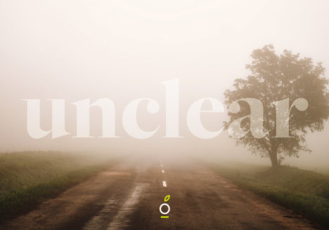 road in fog, words unclear over it